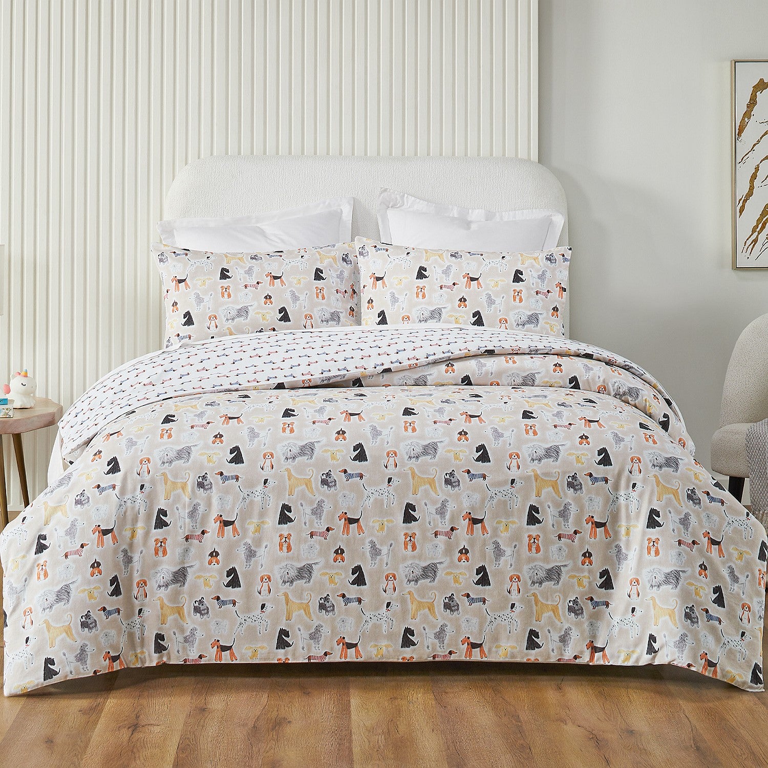 Bed with dog-patterned bedding in a bedroom setting