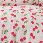 Close up of kids red strawberry print duvet cover.