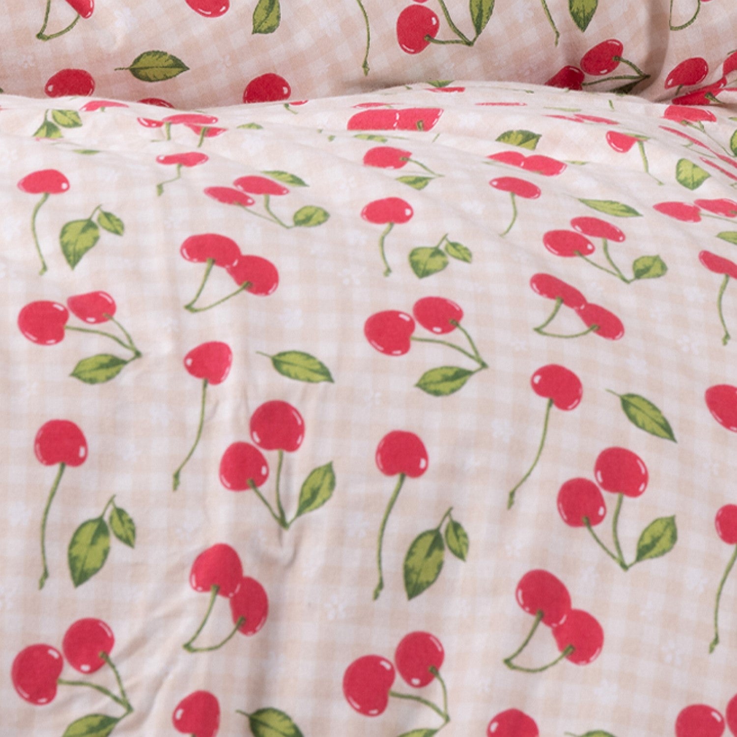 Close up of kids red strawberry print duvet cover.