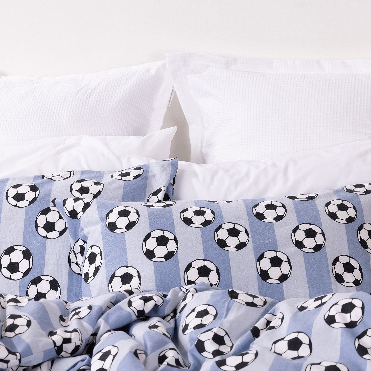 Kids football print duvet cover set close up with white pillowcases in the background