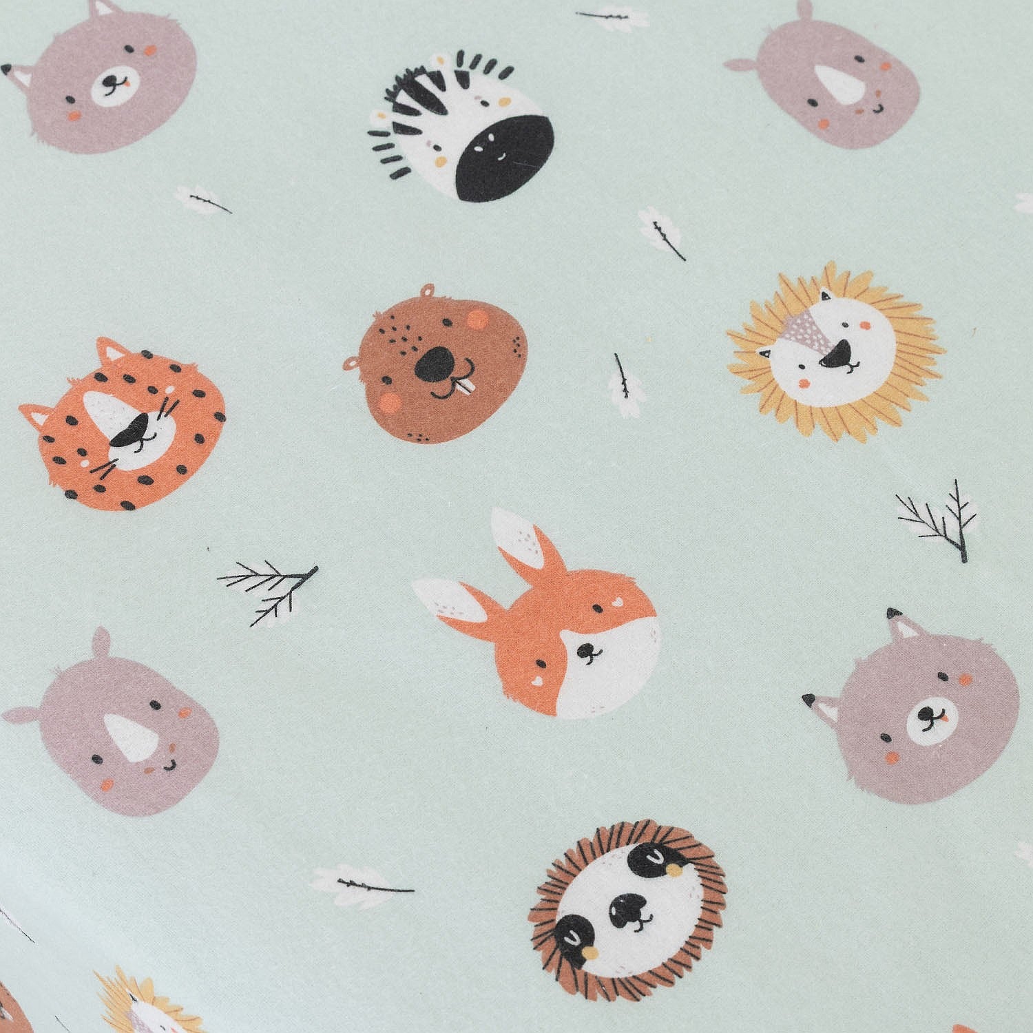 Pattern of cartoon animal faces on a light blue background