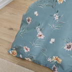 Floral-patterned fabric on a wooden floor