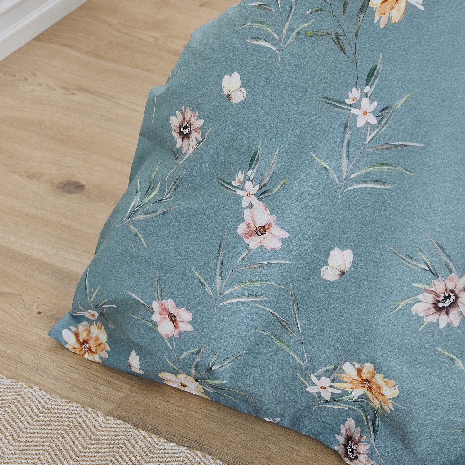 Floral-patterned fabric on a wooden floor