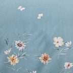 Floral pattern with flowers and butterflies on a blue background
