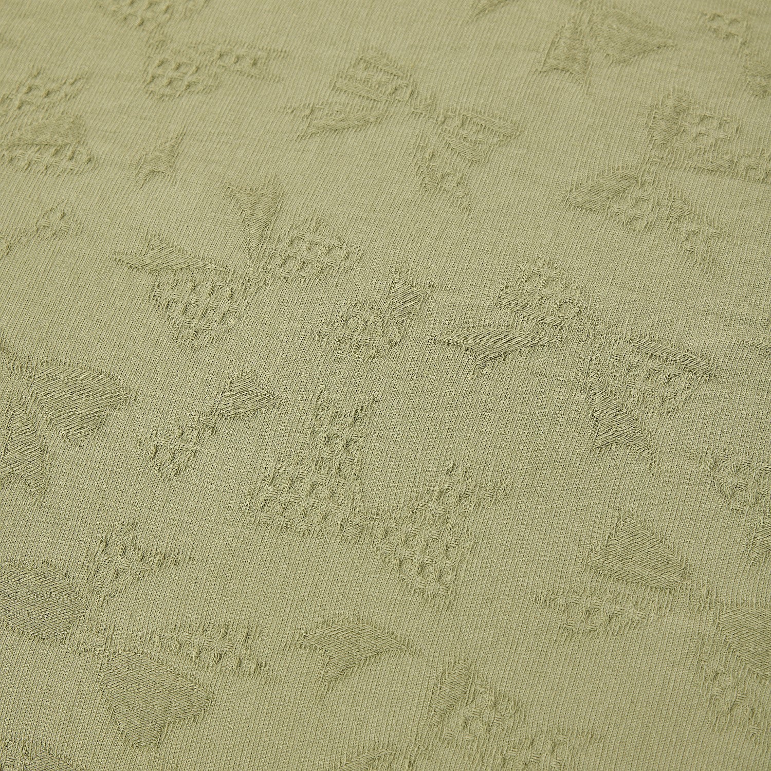 Textured green fabric with geometric pattern