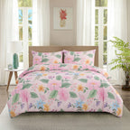 Floral comforter set on a bed in a bright bedroom with a pineapple artwork on the wall.