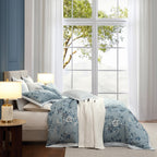 Bedroom with floral bedding and large window