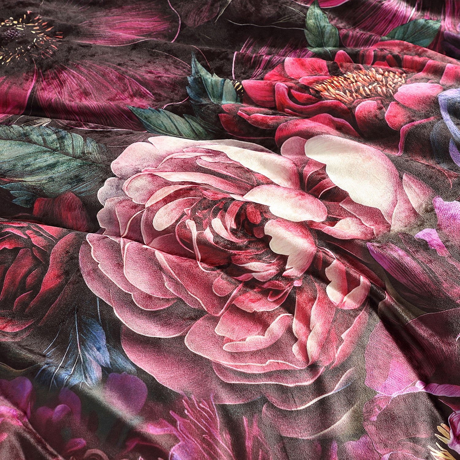 Close-up of a floral pattern with pink and red flowers on a dark background