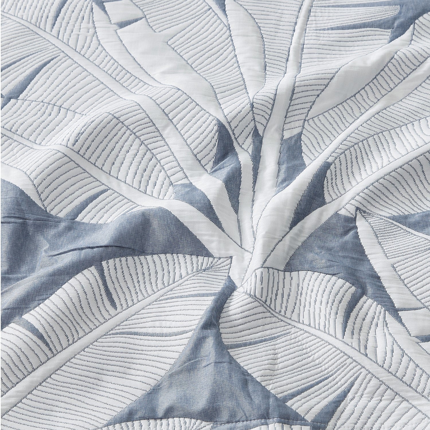 Close-up of a blue and white leaf patterned fabric