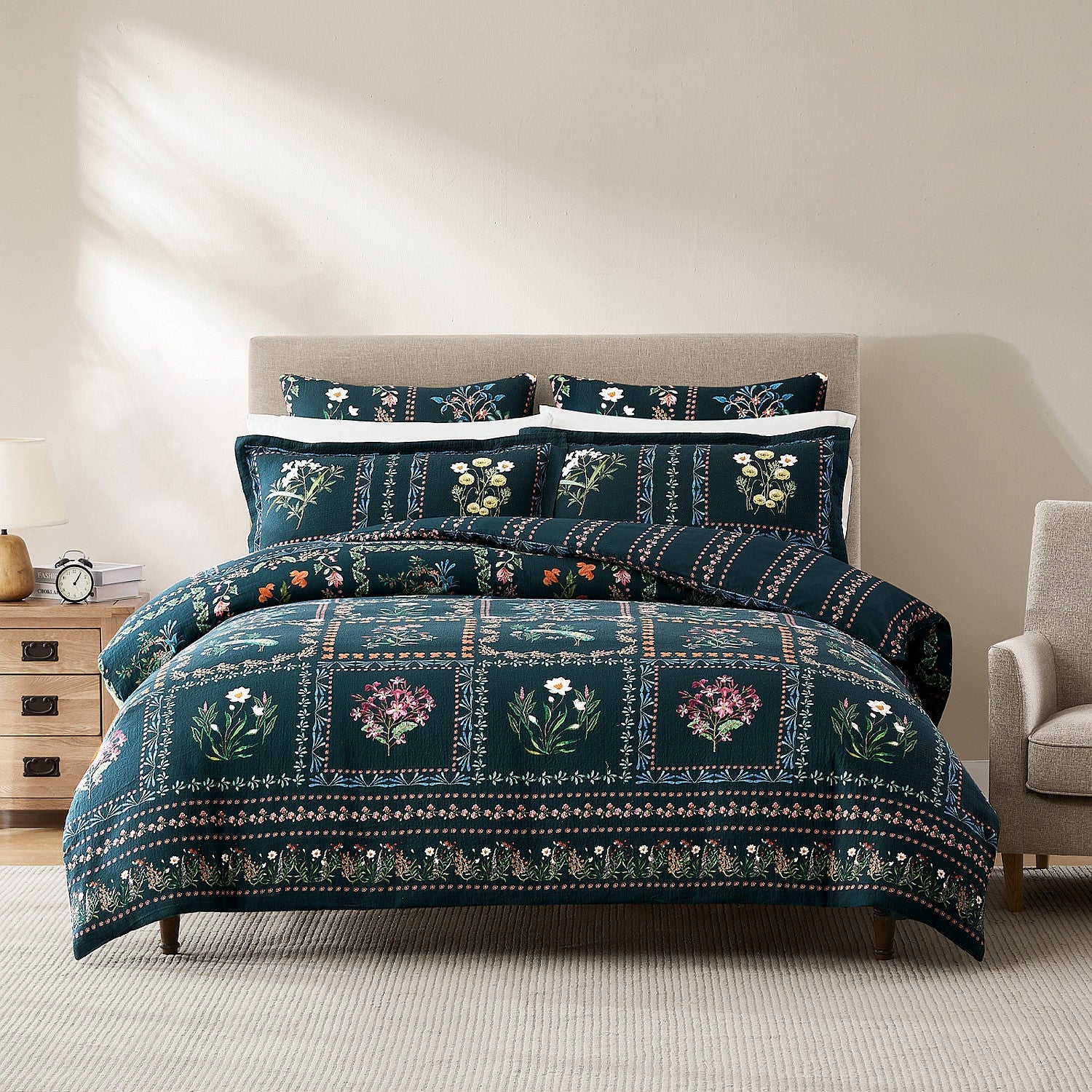 Floral patterned comforter set on a bed in a bedroom setting