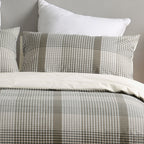 Checkered bedding set with pillows on a neutral background
