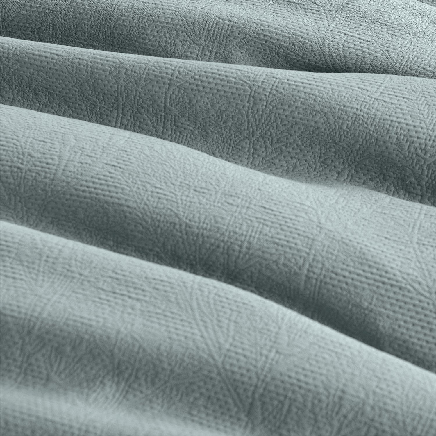 Close-up of textured light blue fabric with a subtle pattern