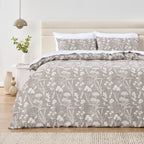 Bed with floral patterned bedding in a bedroom setting