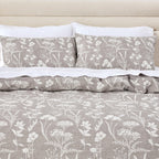 Floral pattern with white flowers and leaves on a gray background