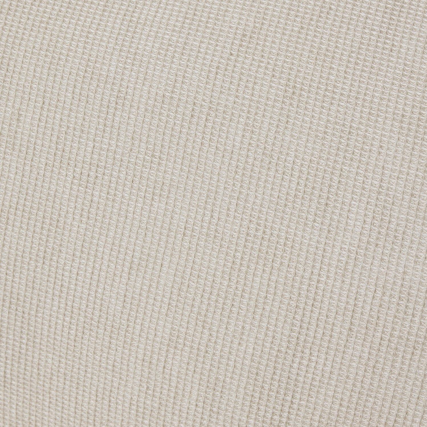 Close-up of a textured beige fabric surface