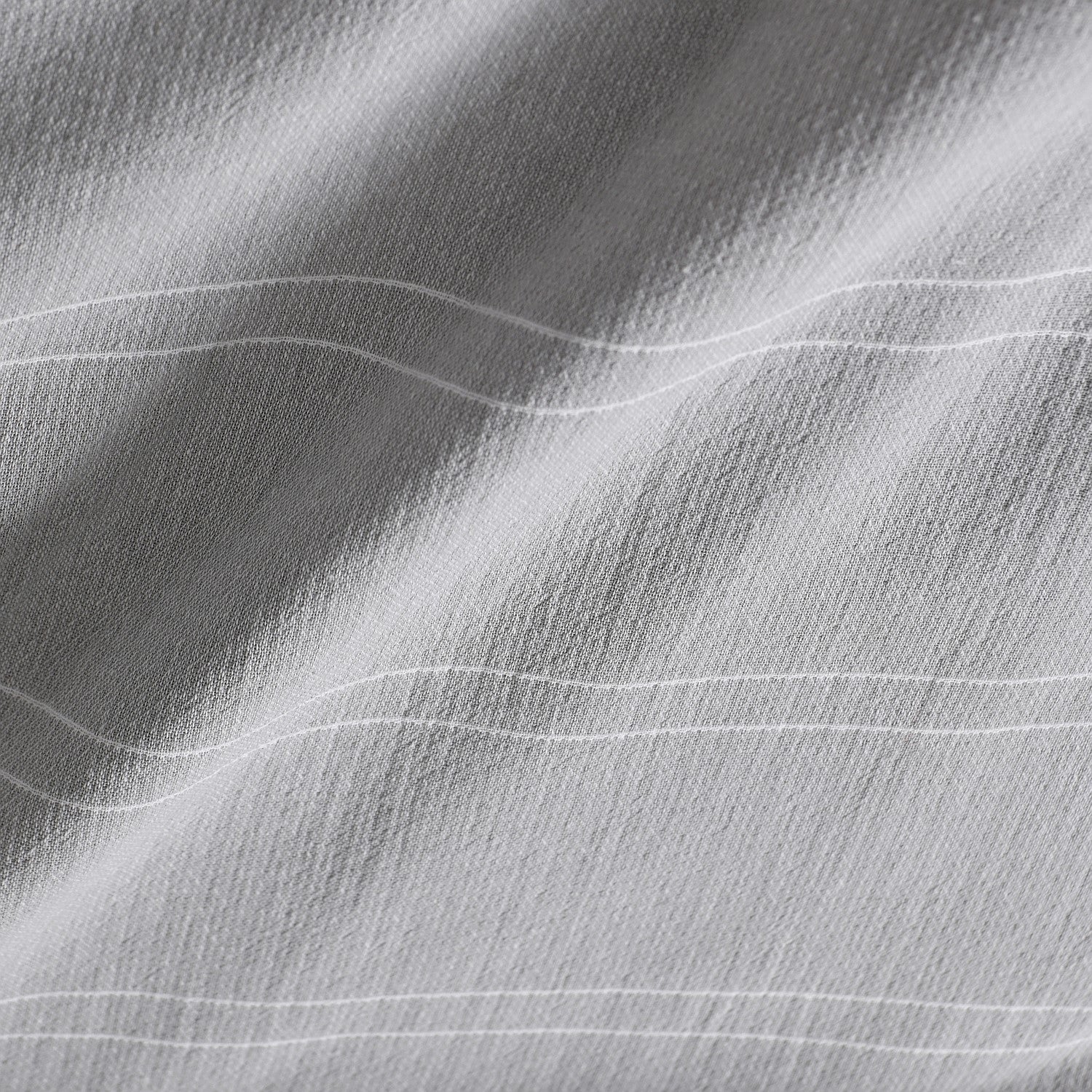 Close-up of gray fabric with wavy texture