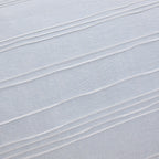Close-up of light blue fabric with horizontal pleats