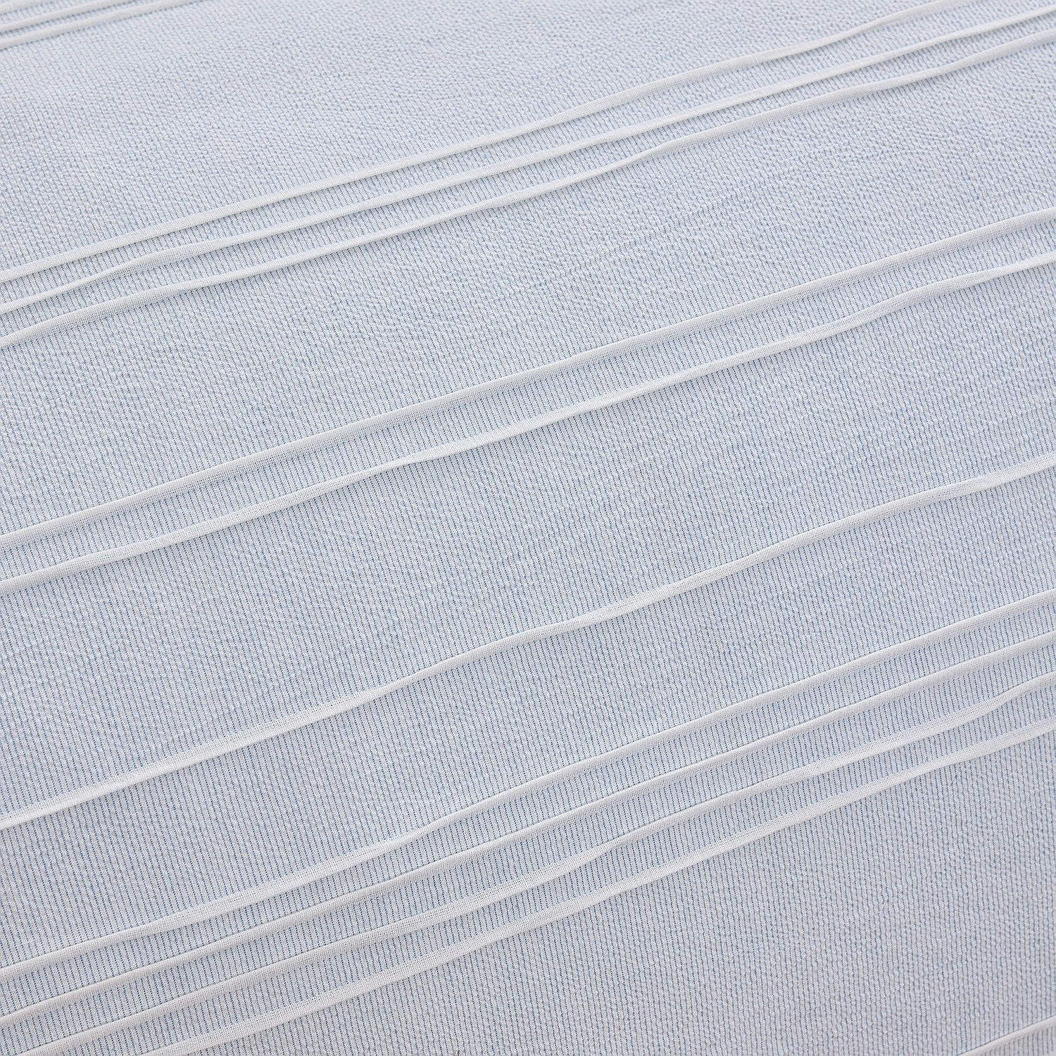 Close-up of light blue fabric with horizontal pleats