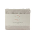 Folded linen duvet cover set with 'ecanthology' label on a white background