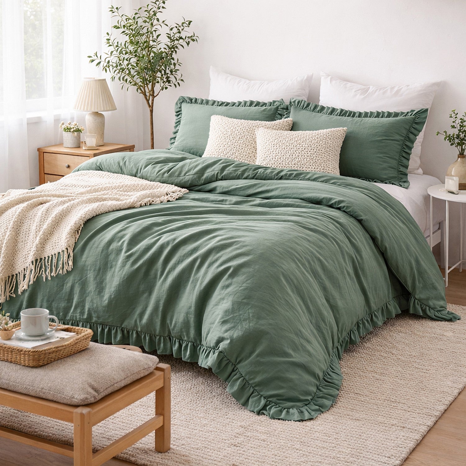 Green bedding set on a bed in a bedroom with a wooden nightstand and lamp.