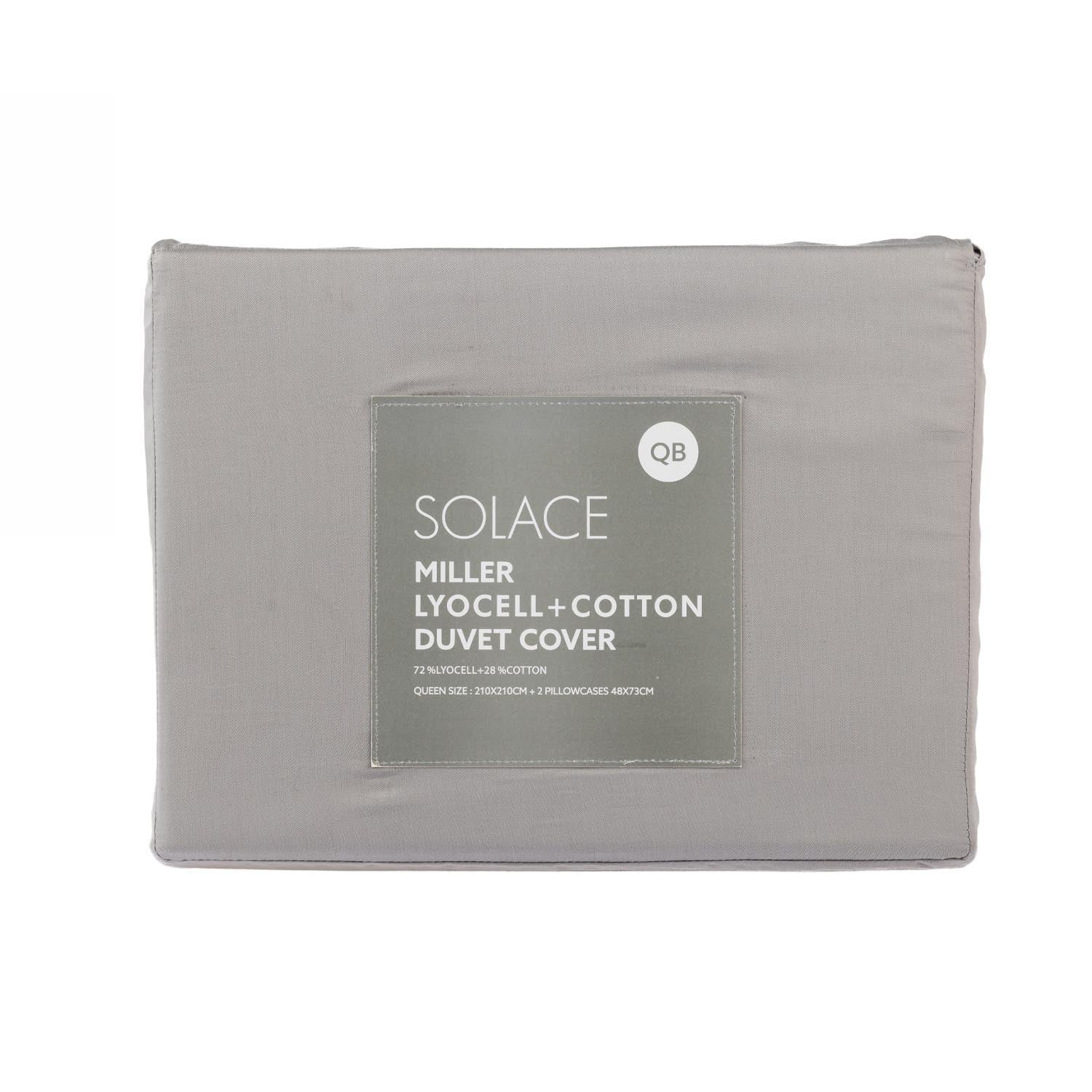 Folded grey lyocell and cotton duvet cover set in retail packaging with product label displayed on a light grey background.