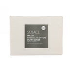 Folded Yellow lyocell and cotton duvet cover set in retail packaging with product label displayed on a light grey background.