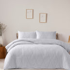 Bed styled with the Hometones Hamilton Check duvet cover set in Grey, featuring a subtle woven check pattern and matching pillowcases.
