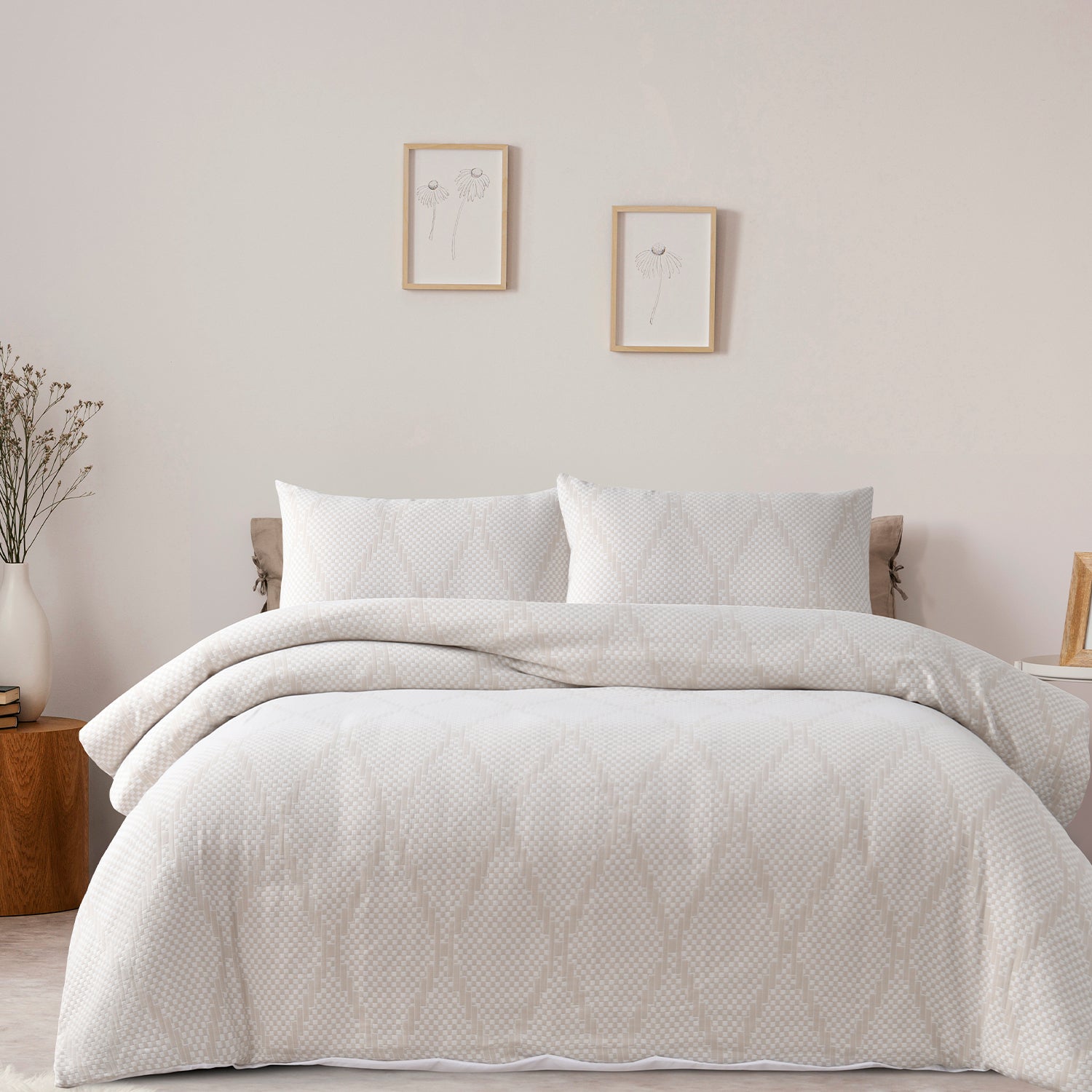 Bed styled with the Hometones Hamilton Check duvet cover set in Natural, featuring a subtle woven check pattern and matching pillowcases.