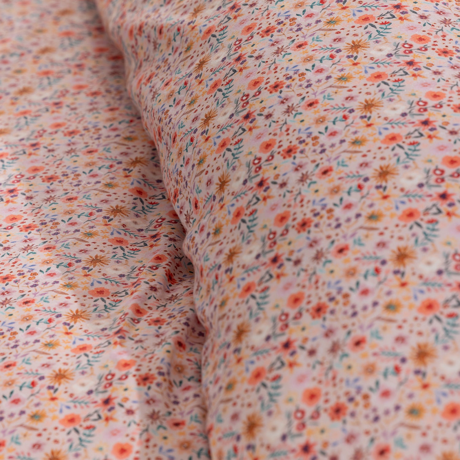 Detailed close-up of the Marlo Mia Floral fabric showcasing the colourful floral pattern and soft cotton sateen finish.
