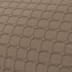 Close-up of the Fieldcrest Maison cotton duvet cover fabric showcasing the raised geometric textured pattern in mocha.