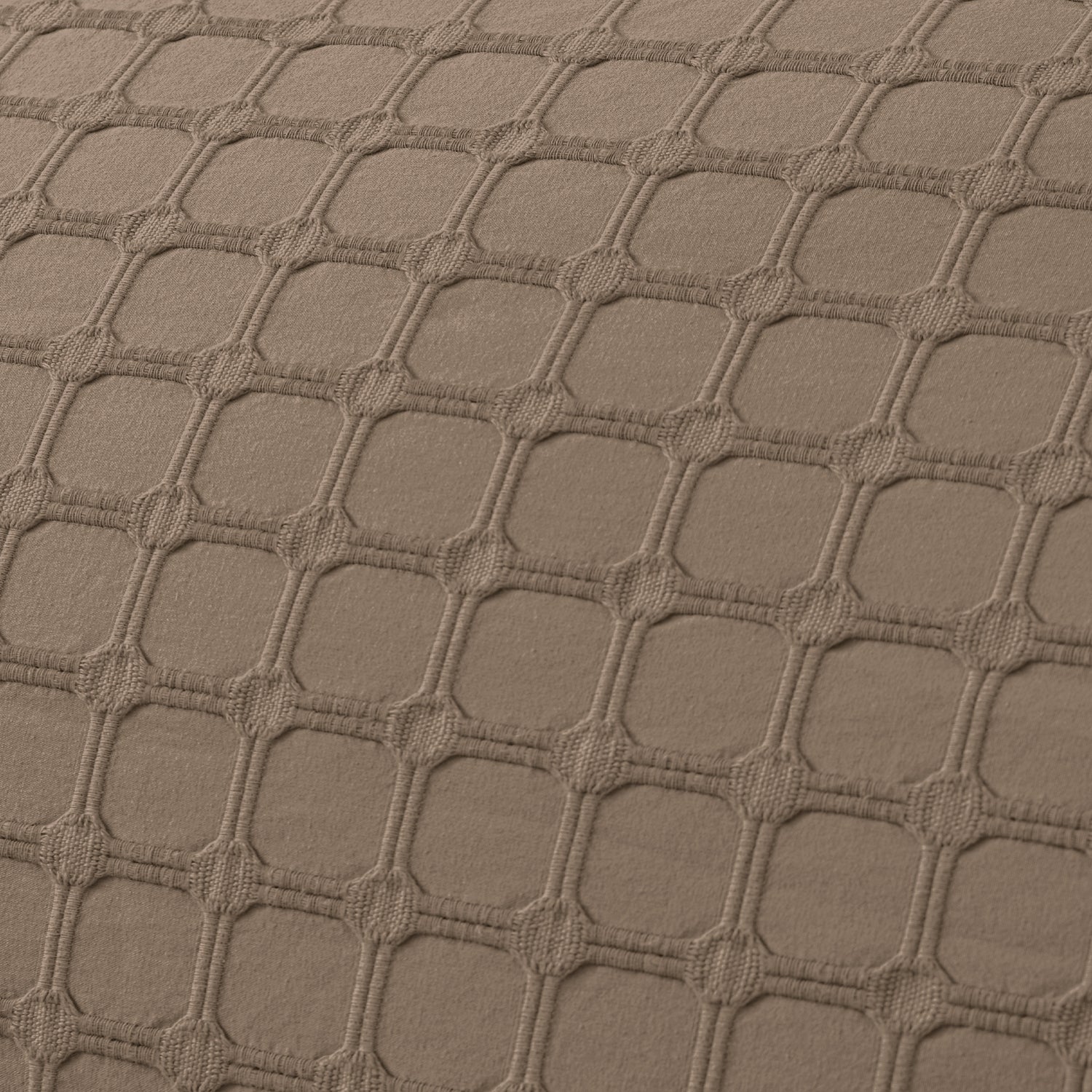 Close-up of the Fieldcrest Maison cotton duvet cover fabric showcasing the raised geometric textured pattern in mocha.
