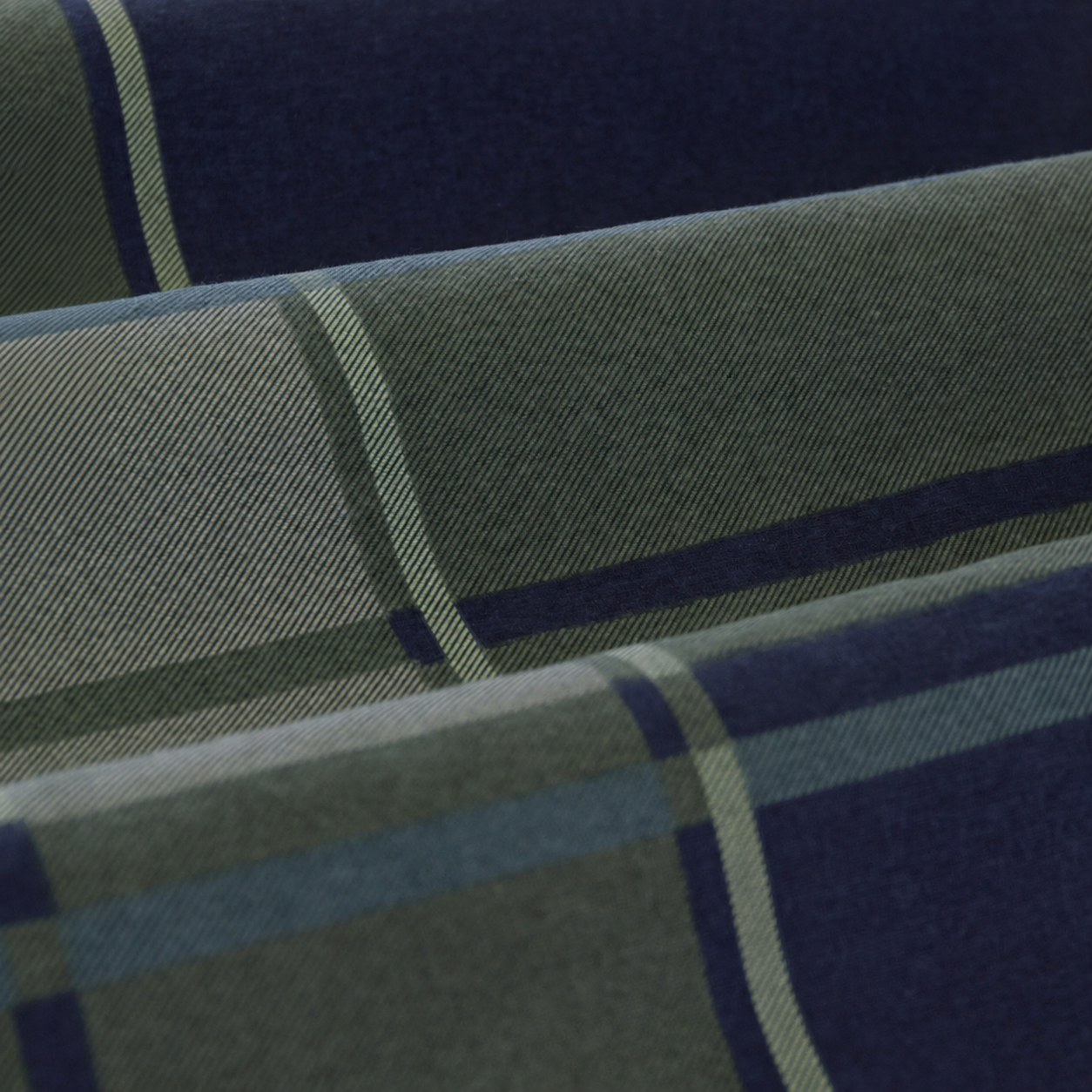 Close-up of fabric with blue and green plaid pattern