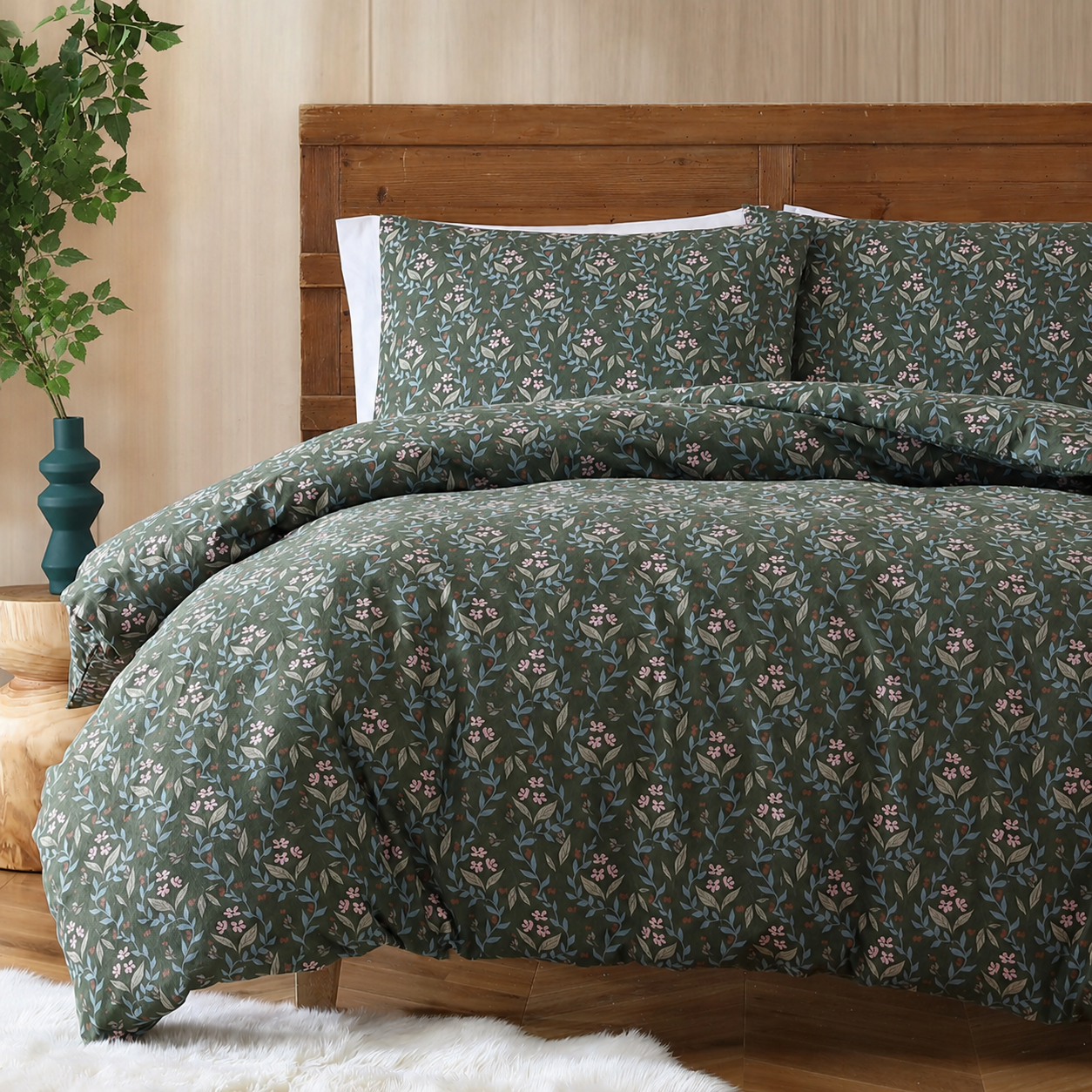 Floral patterned bedding set on a bed with a wooden headboard.