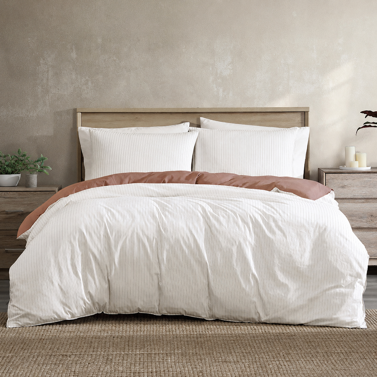 Bed with white bedding and brown accent in a bedroom setting