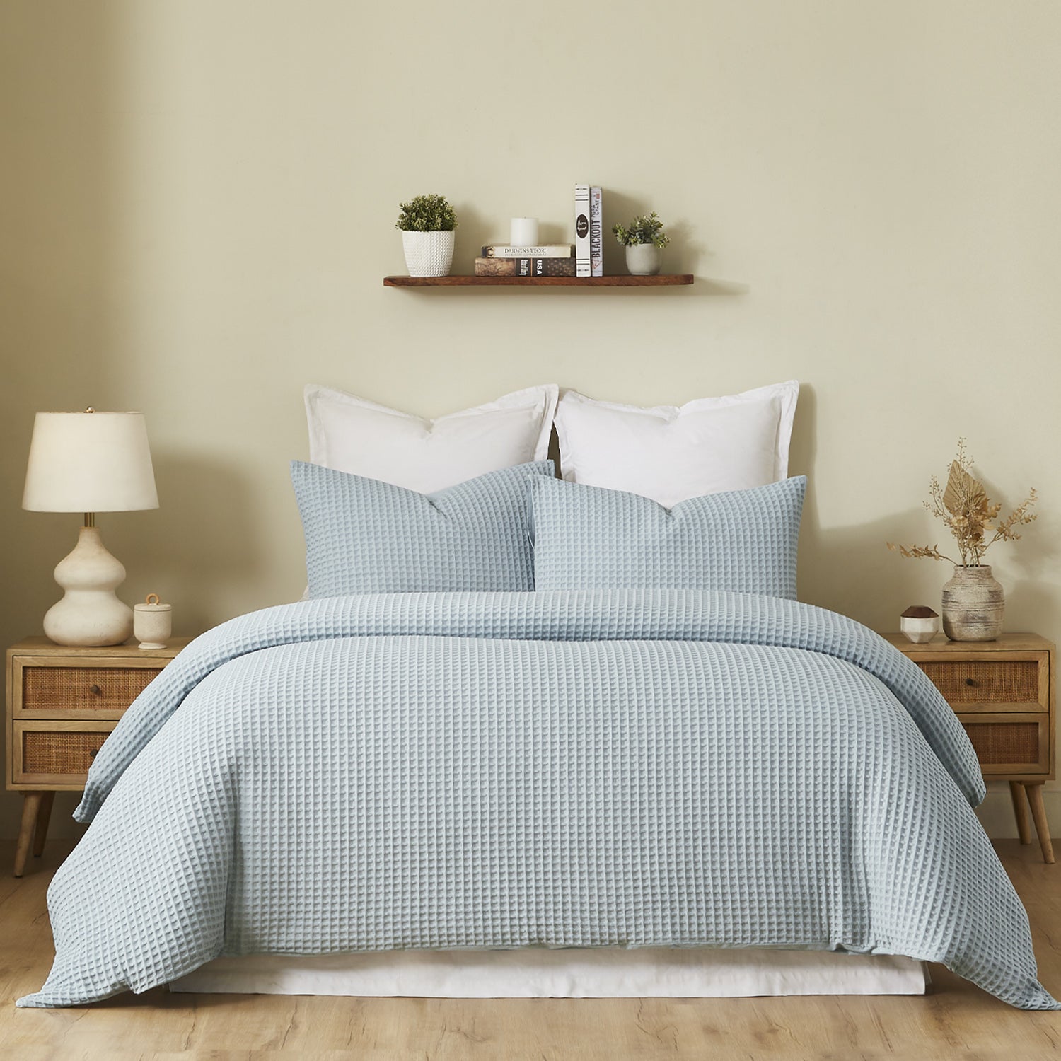 Fieldcrest Chunky Waffle Duvet Cover Set in Dusty Blue, styled on a bed with matching textured pillowcases in a warm neutral bedroom.