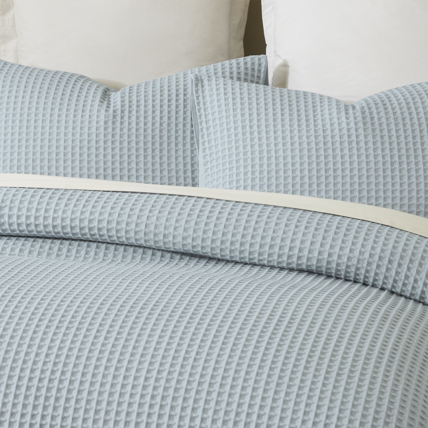 Close-up of the Dusty Blue Fieldcrest Chunky Waffle Duvet Cover Set, showing the raised waffle texture across the duvet cover and pillowcases.