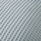 Close-up detail of the Dusty Blue chunky waffle fabric, highlighting the soft textured woven pattern.