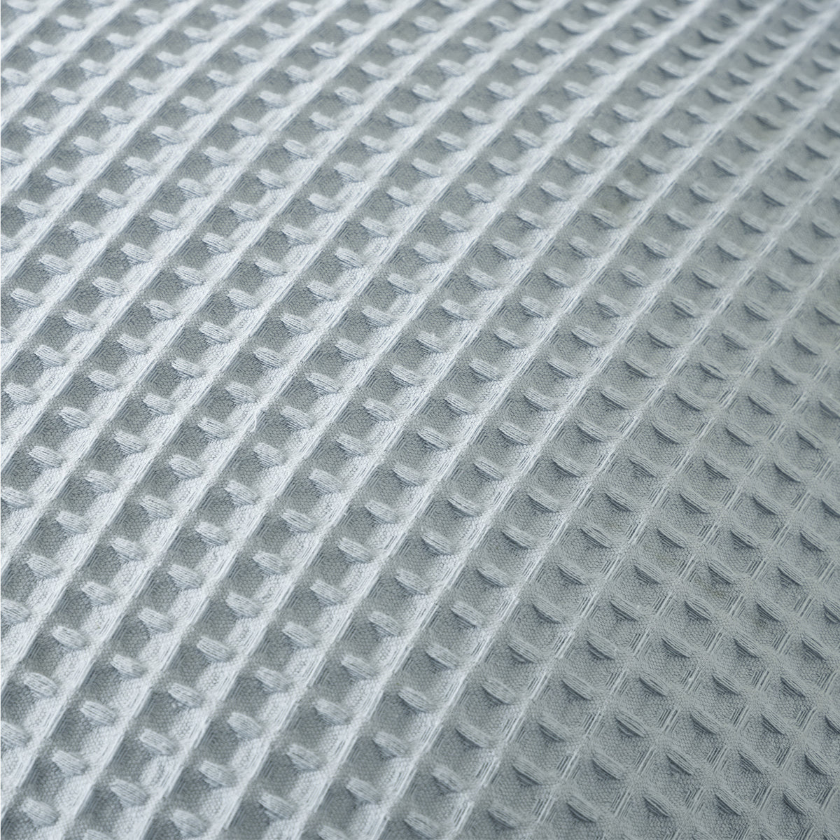Close-up detail of the Dusty Blue chunky waffle fabric, highlighting the soft textured woven pattern.