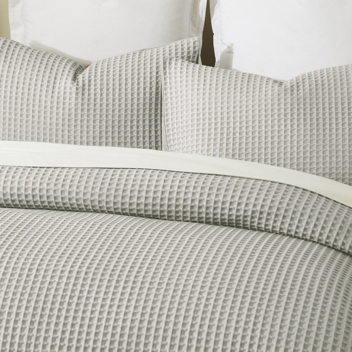 Close-up of the Stone Fieldcrest Chunky Waffle Duvet Cover Set, showing the raised waffle texture across the duvet cover and pillowcases.