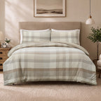 Fieldcrest Oxford Cotton Check Duvet Cover Set in Natural styled on a bed with matching pillowcases in a warm, neutral bedroom.