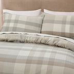 Close-up of the Fieldcrest Oxford Cotton Check Duvet Cover Set in Natural, featuring a soft cream, beige and taupe check pattern with matching pillowcases.