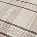 Close-up of the Fieldcrest Dallas Cotton Check Duvet Cover Set showcasing the fine check pattern with contrasting brown stripes and soft beige detailing on a cream background.
