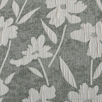 Close-up of the green and white floral pattern showing the textured cotton fabric and floral design.