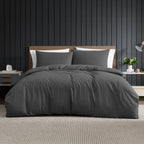 Home Co. Soft Touch Easy Care Duvet Cover Set in Charcoal, styled on a bed with coordinating pillowcases in a modern bedroom.