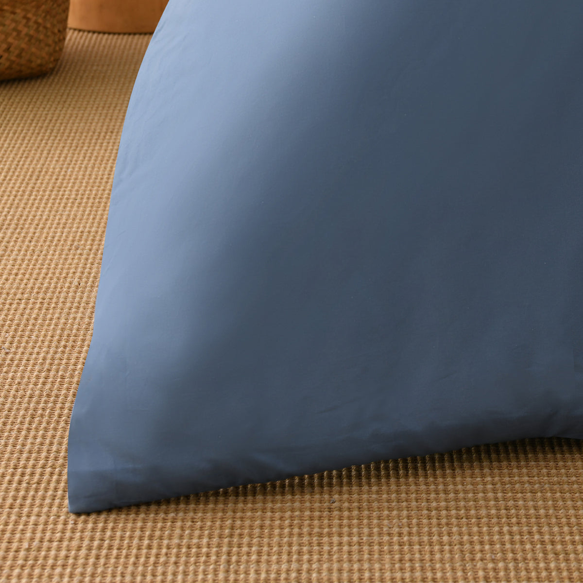 Close-up of the deep blue fabric of the Solace Arden Reversible Duvet Cover Set, showing its smooth finish and soft drape.
