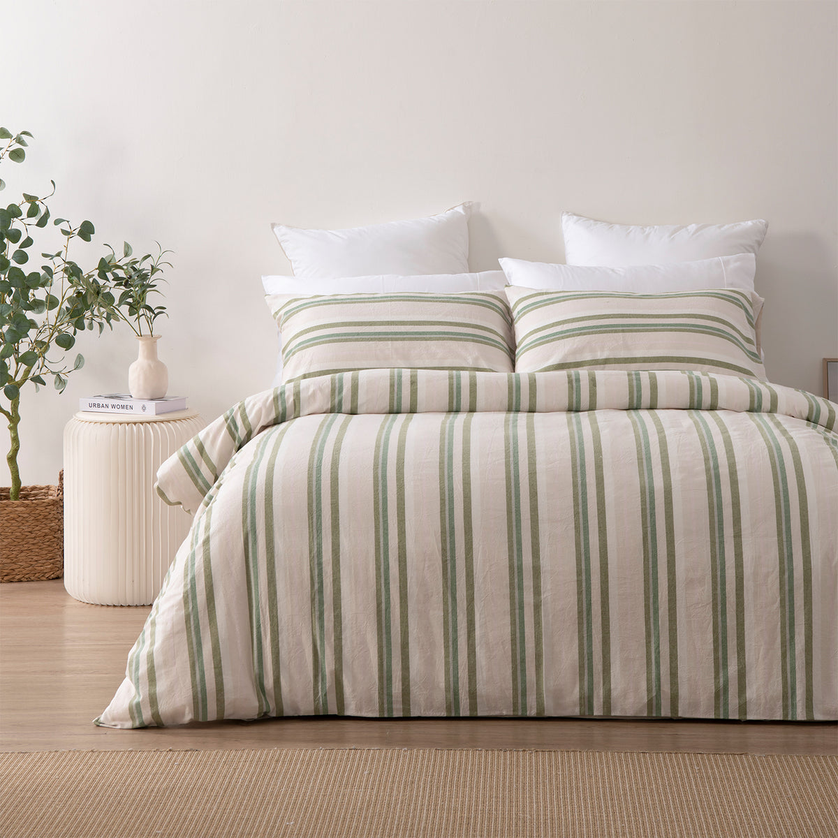 Marlo Neve Cotton Duvet Cover Set styled in a bright bedroom, showcasing the fresh green striped design across the duvet cover and matching pillowcases.