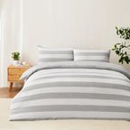 Baker St. Linen Samson Cotton Jacquard Duvet Cover Set featuring broad grey and white horizontal stripes, styled on a bed with matching pillowcases in a neutral bedroom.