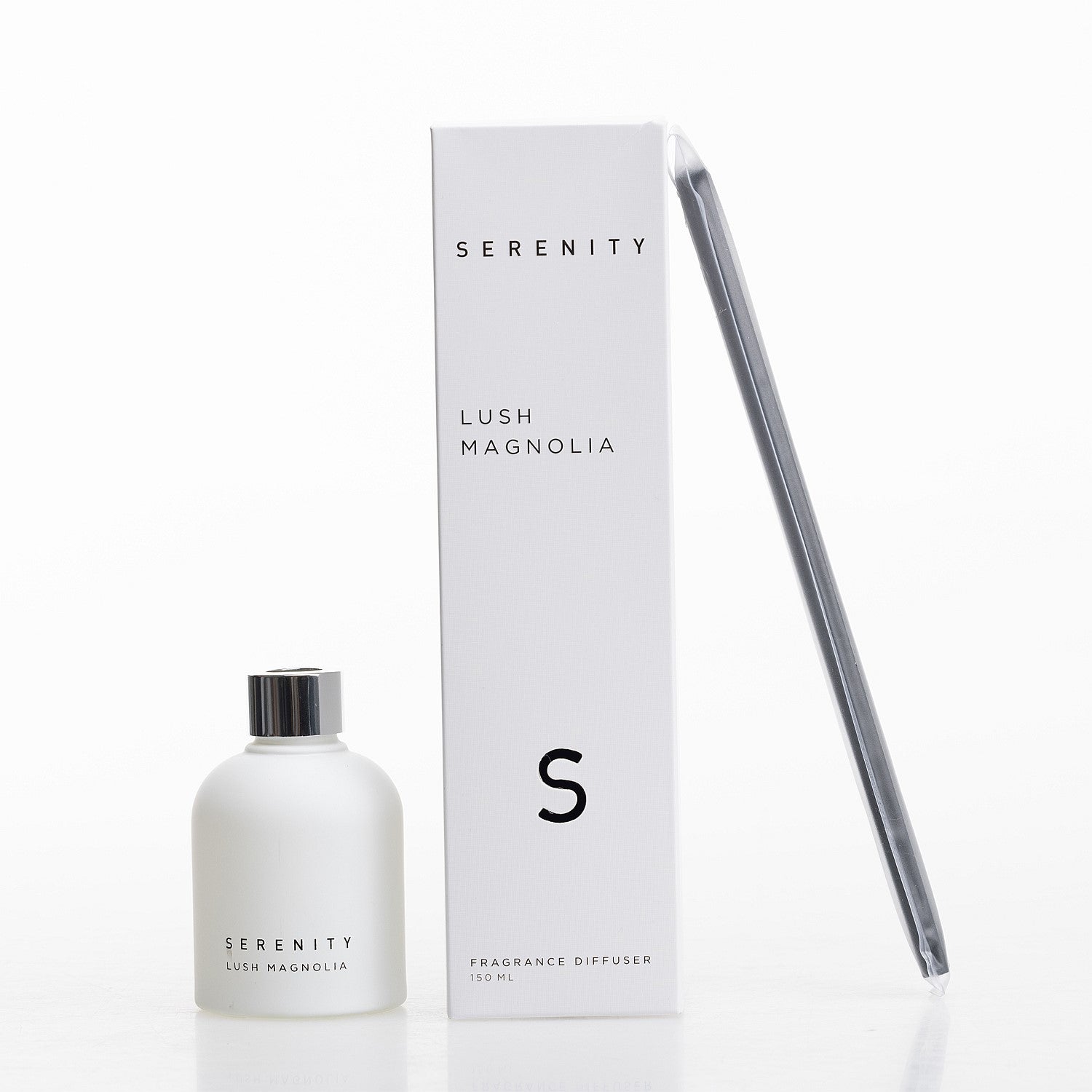 Serenity Lush Magnolia diffuser with frosted white bottle, matching box, and reed sticks.