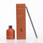 Serenity Tropical Papaya diffuser with frosted orange bottle, matching box, and reed sticks.