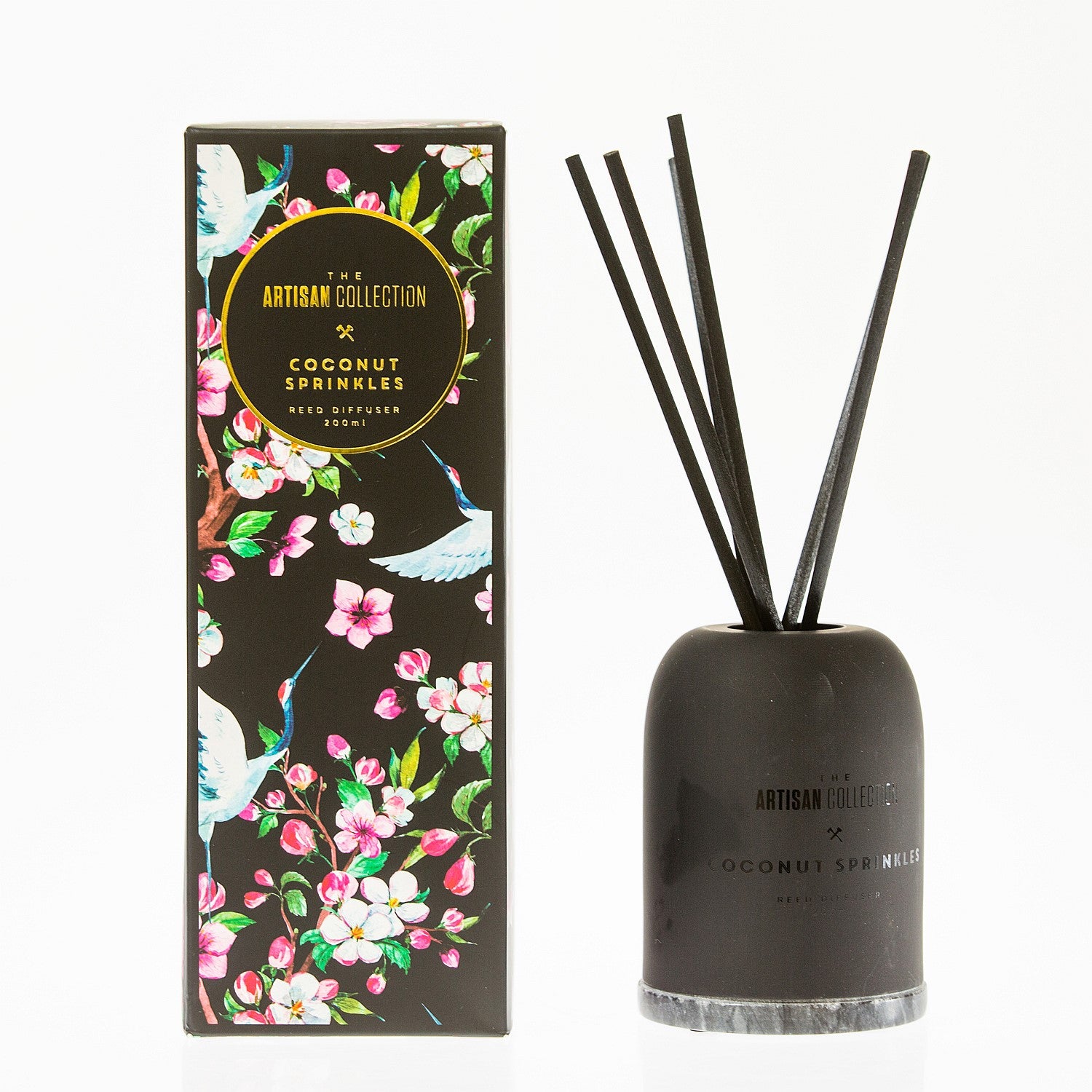 The Artisan Collection Coconut Sprinkles 200ml reed diffuser with black floral box.